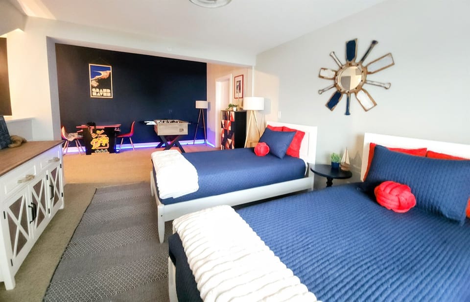 Game loft with two twin beds (cotton Oeko-Tex linens) and Coast Guard design. Kids' favorite space - foosball, arcade, and board games keep them entertained for hours.