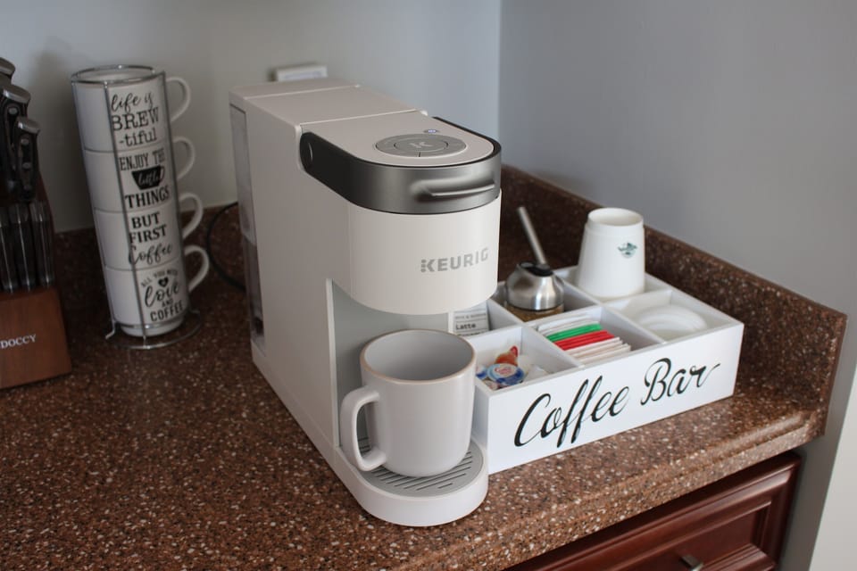 Coffee, creamer, and teas provided to start your mornings. Coffee shop also steps away across the parking lot.