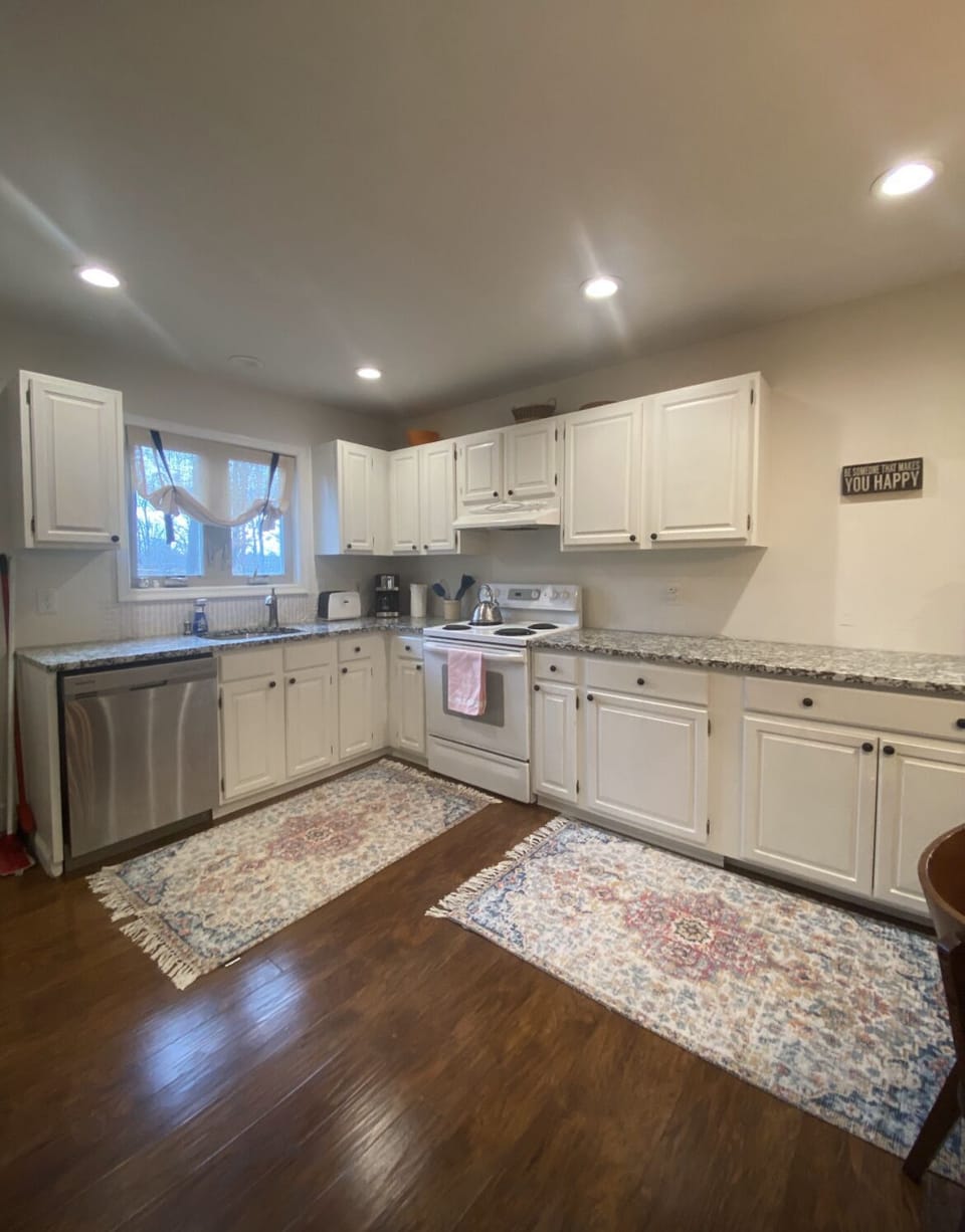Kitchen 
Electric stove 
Fridge, microwave, coffee maker toaster 
Washer dryer