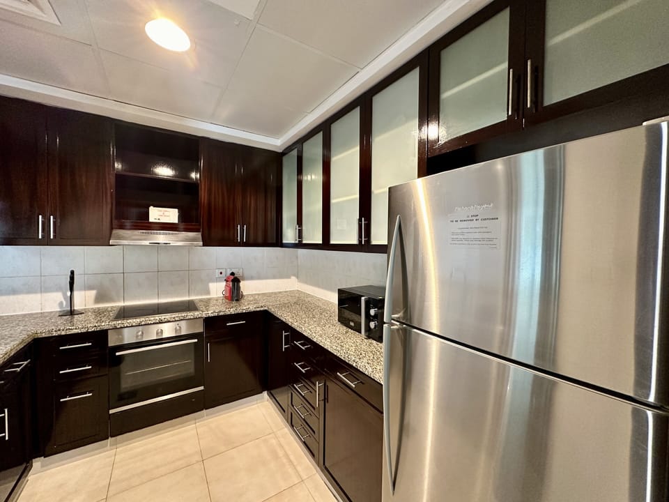 Exclusive Apartment | Private kitchen | Full-size fridge, microwave, oven, stovetop