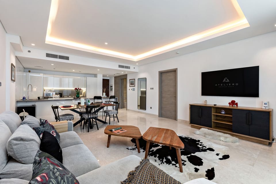 Premium Apartment, 1 Bedroom, Balcony, City View | Living room | 50-inch Smart TV with digital channels