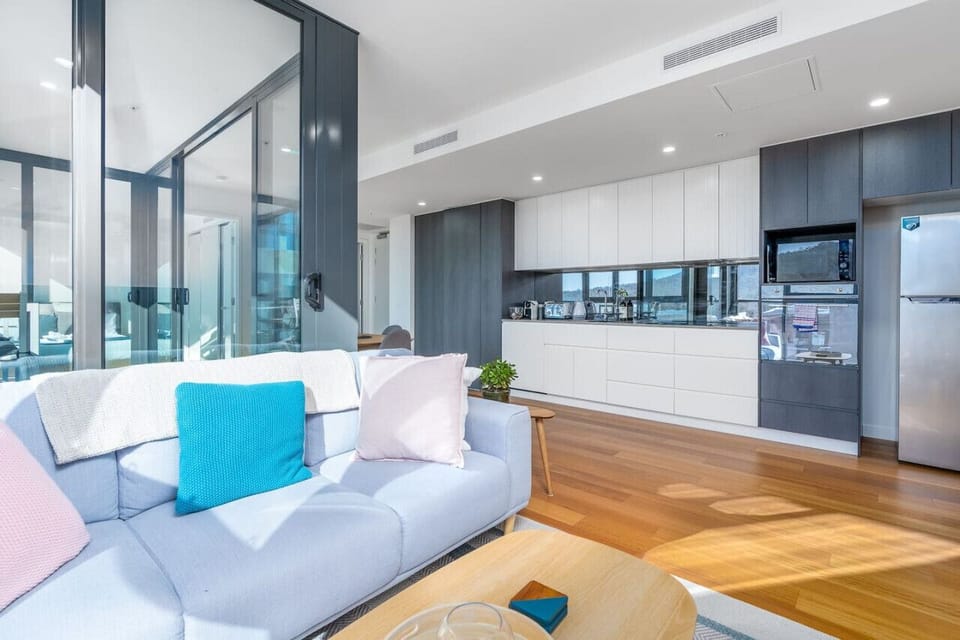Enjoy the comfort of our cozy lounge, complete with a plush sofa and a large window that offers stunning views, perfect for unwinding after a long day.