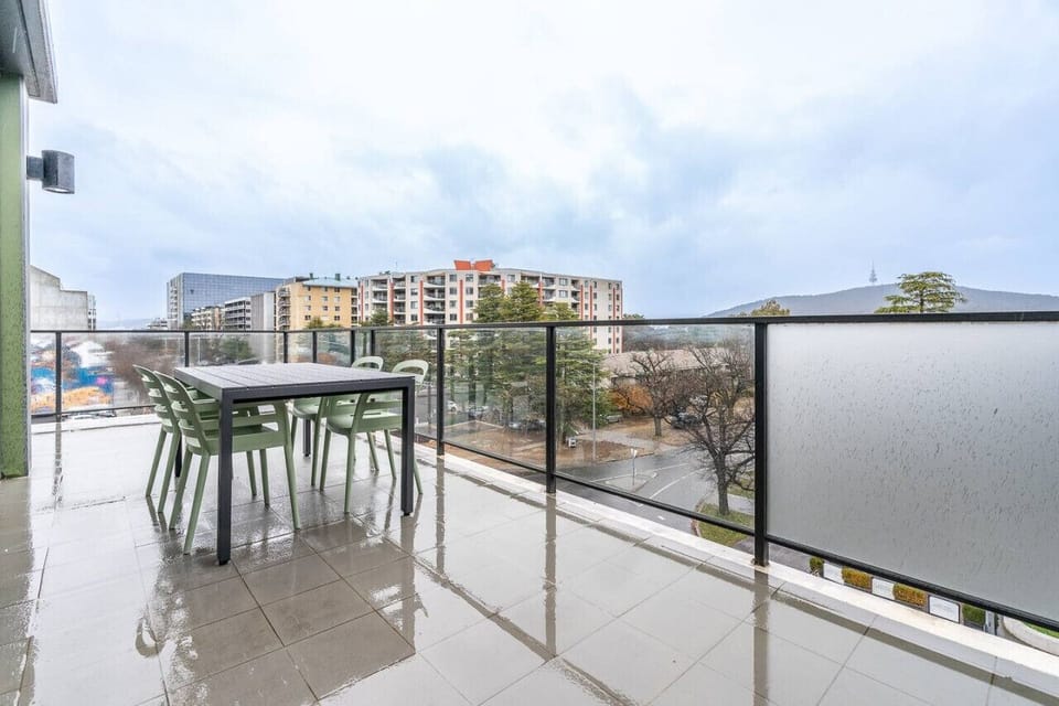 Relax on your private balcony with comfortable seating and enjoy stunning views of Braddon’s vibrant cityscape.