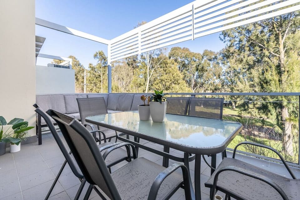 Balcony with table and chairs where you can sit, have your coffee, have some sunlight, and have some fresh air while appreciating the breathtaking view outside.