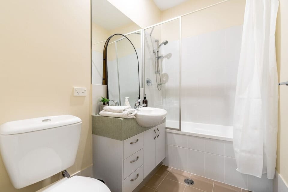 Very clean bathroom includes a bathtub, a shower, a sink, and a toilet.