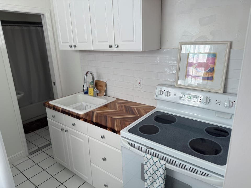 Kitchen with full size fridge and stove