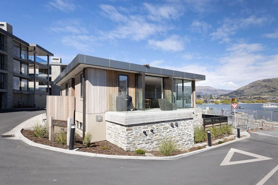 Exterior of the apartment with outdoor seating and BBQ