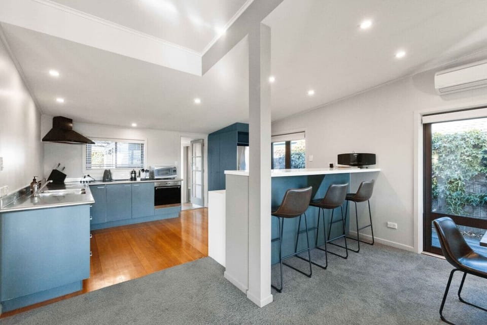 Large Kitchen, bar stools for the entertainers, and a heat pump.