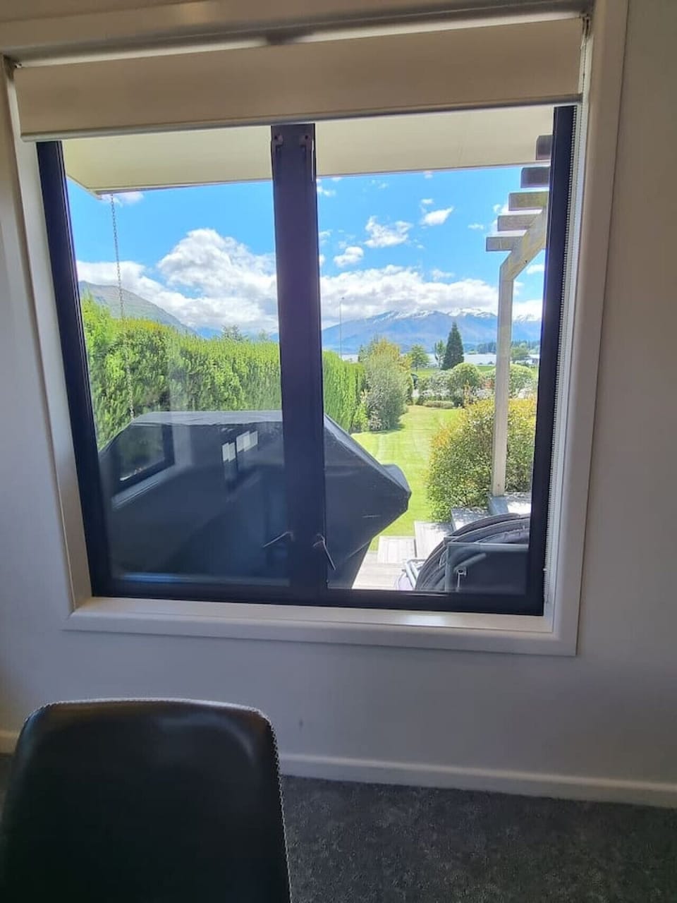 View from the dining room showcasing BBQ and mountains!