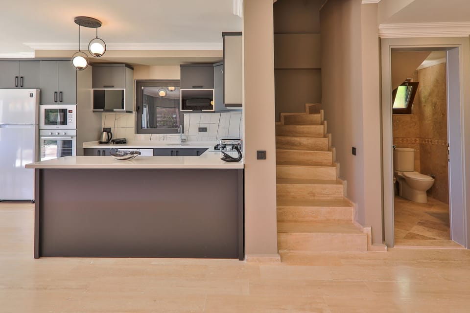 Create gourmet memories in the sleek kitchen of Celik villa