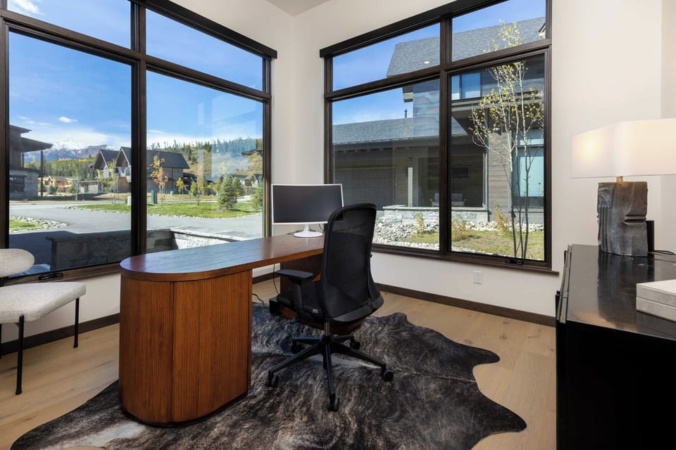 Private office with floor-to-ceiling windows and inspiring views