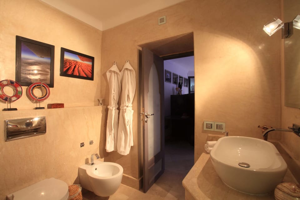 Deluxe Room (Terra) | Bathroom | Shower, designer toiletries, hair dryer, bidet