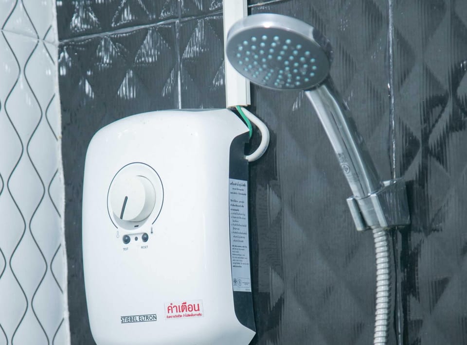 Studio Suite | Bathroom | Shower, hair dryer, towels, soap