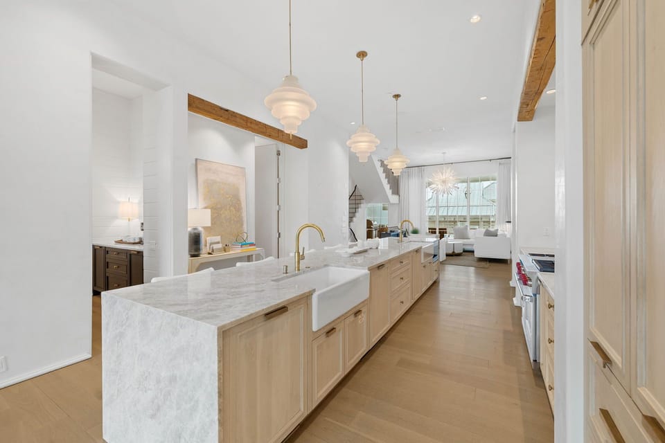 3 Full Sized Kitchen sinks, 2 Dishwashers, Brass fixtures, Taj Mahal Quartz Countertops, Venetian Plaster Walls, European White Oak Counter Tops.
