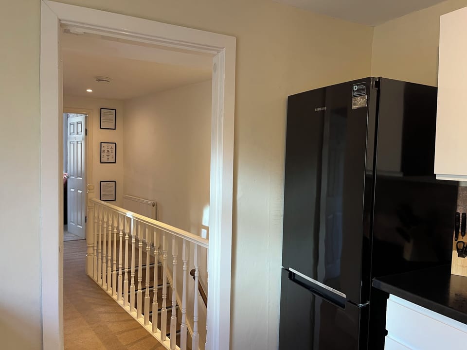 Landing leading into the Living room from the fully fitted kitchen