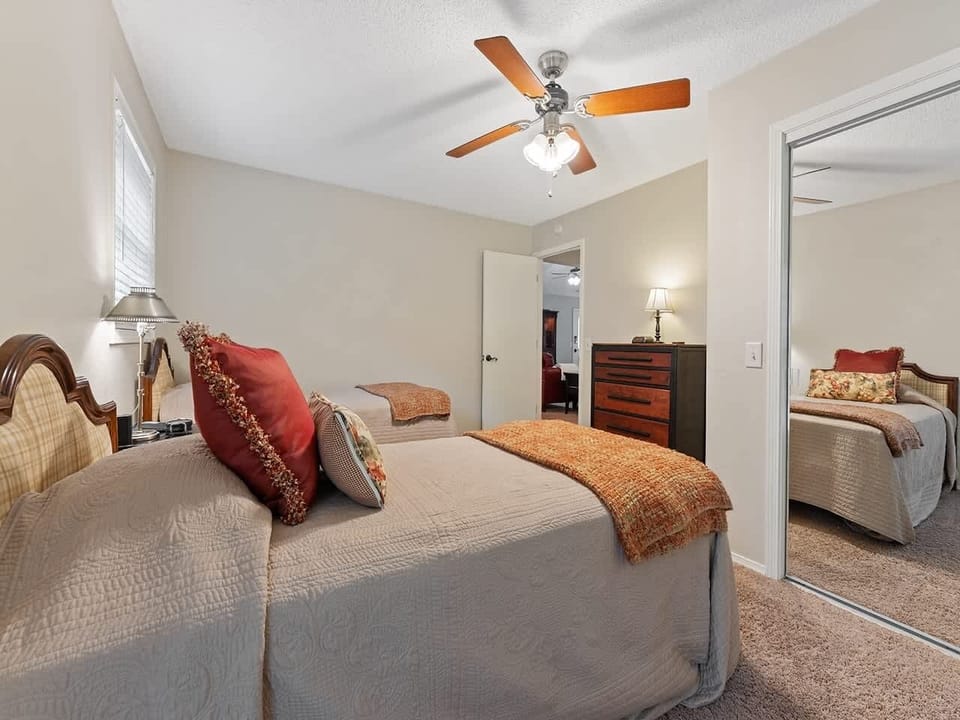 The third bedroom connects directly to the back deck