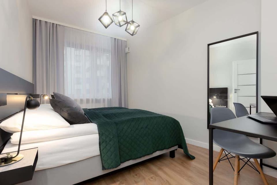 Enjoy the simplicity and comfort of the bedroom's modern design. 