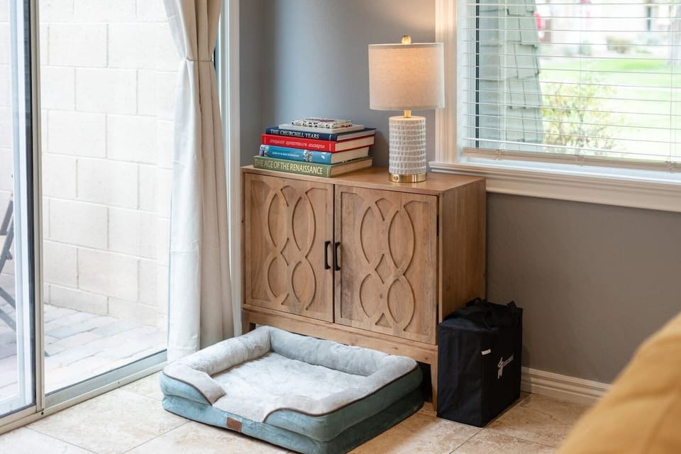 We got you covered with books, games (inside the cabinet) and even a bed for the fur family.