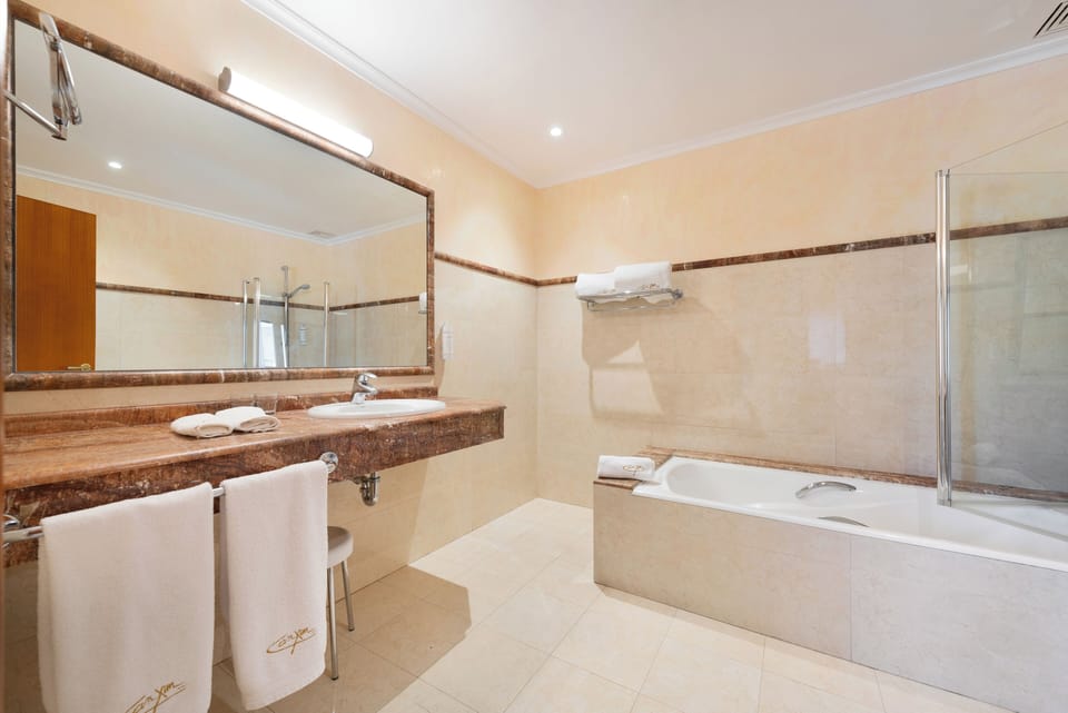 Standard Double Room | Bathroom | Combined shower/tub, deep soaking tub, hair dryer, bidet