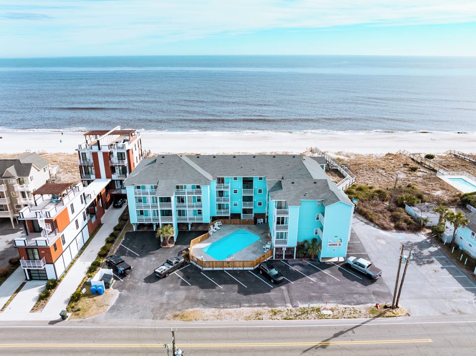 Coastal property features beachfront access with pristine sandy shores and sparkling ocean views just steps from your door.