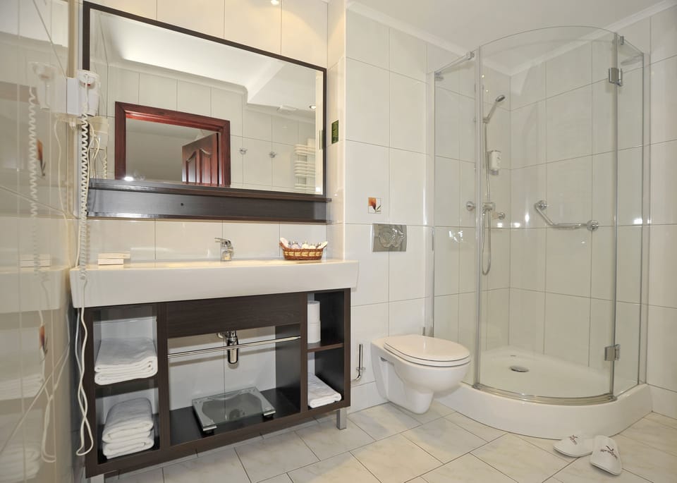 Designer toiletries, hair dryer, towels