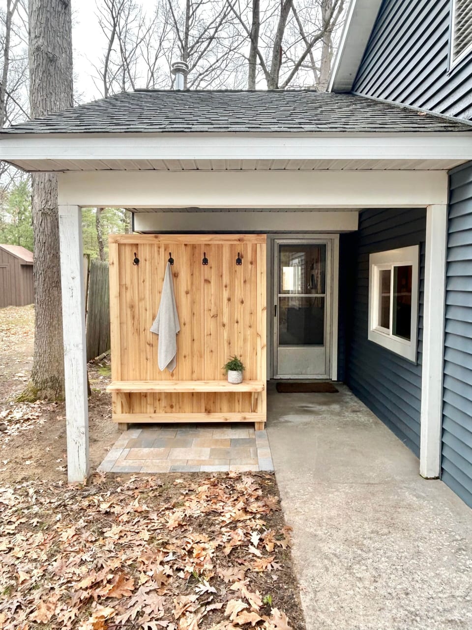 Relax in the spa-like outdoor shower after enjoying the sun and the sand at Torch Lake.