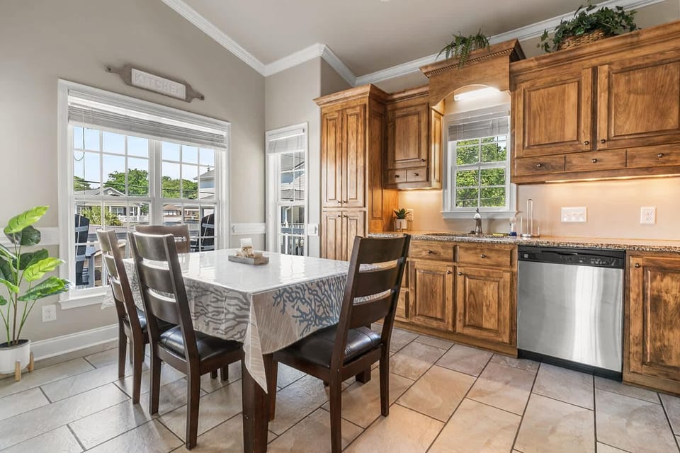 Sunlit kitchen and dining area with garden views