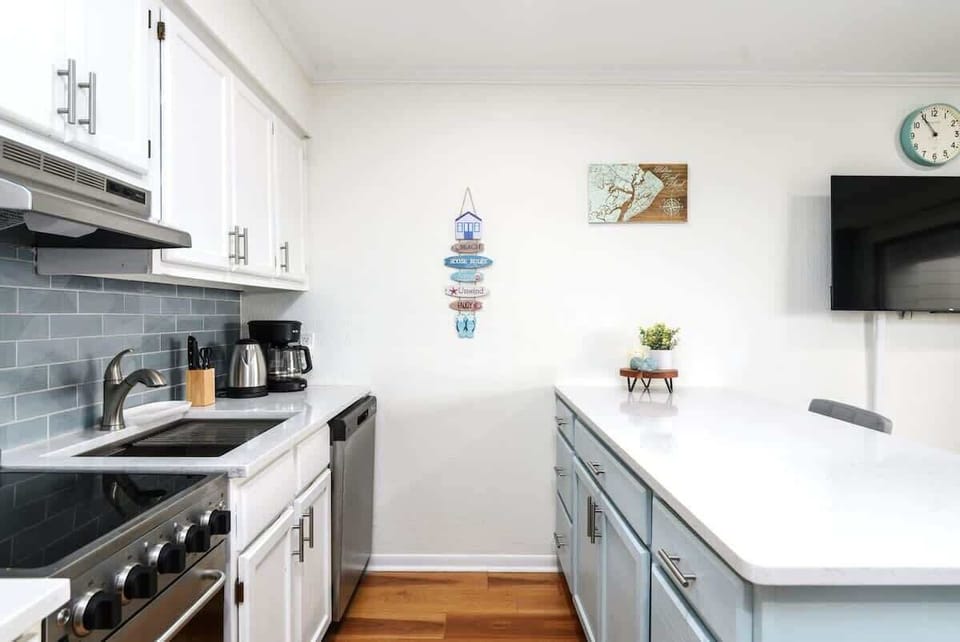 Two updated kitchen spaces are shown, including a large white island.