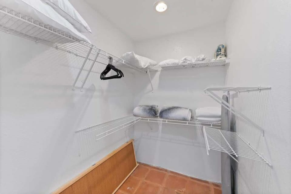 Storage room with fresh sheets and pillows available