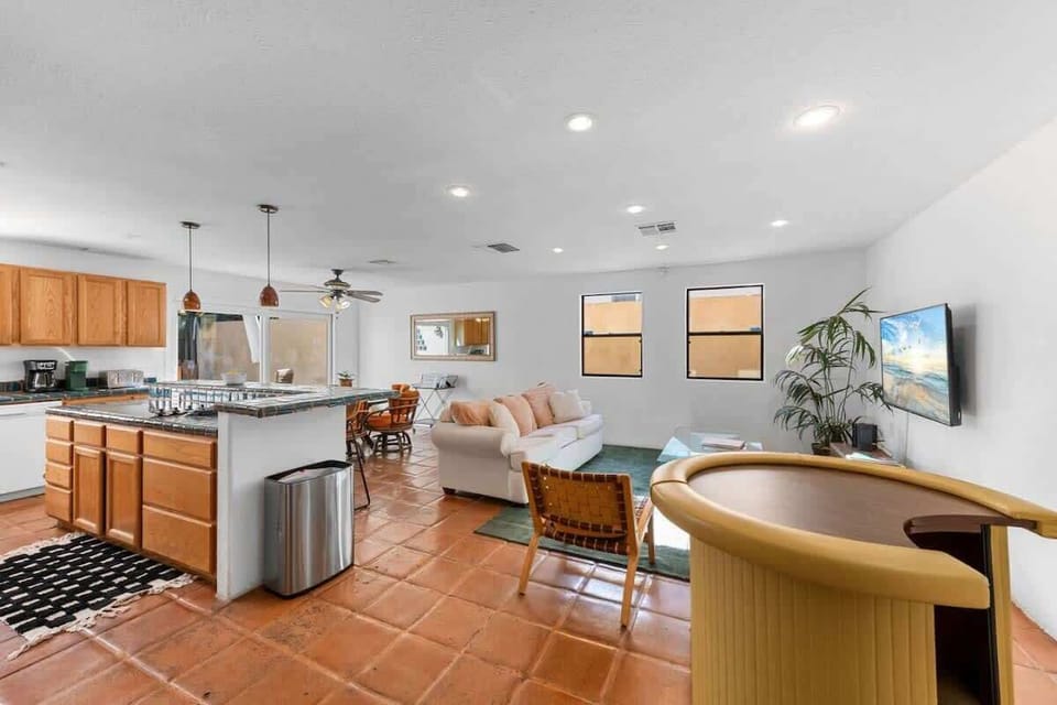 Open-concept living area for group gatherings attached with kitchen