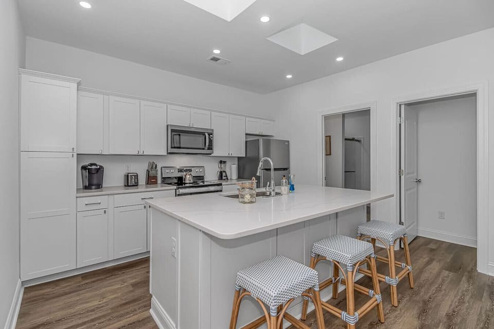 Spacious kitchen with oversized island and bar seating ideal for meals and socializing