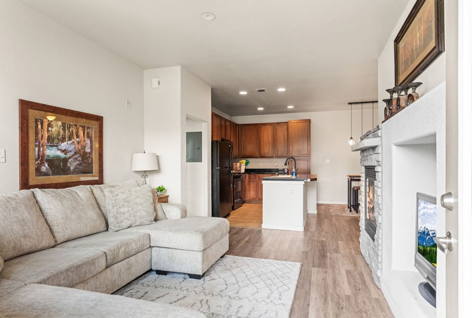 Spacious living area with gas fireplace and plenty of seating. 