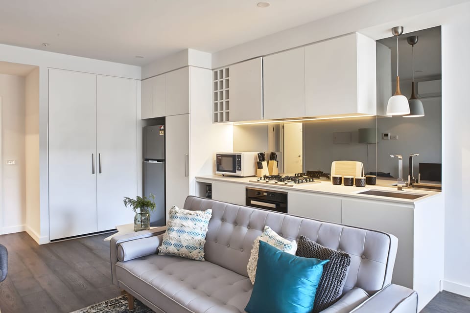 Deluxe Apartment | Living area | 55-inch LED TV with cable channels