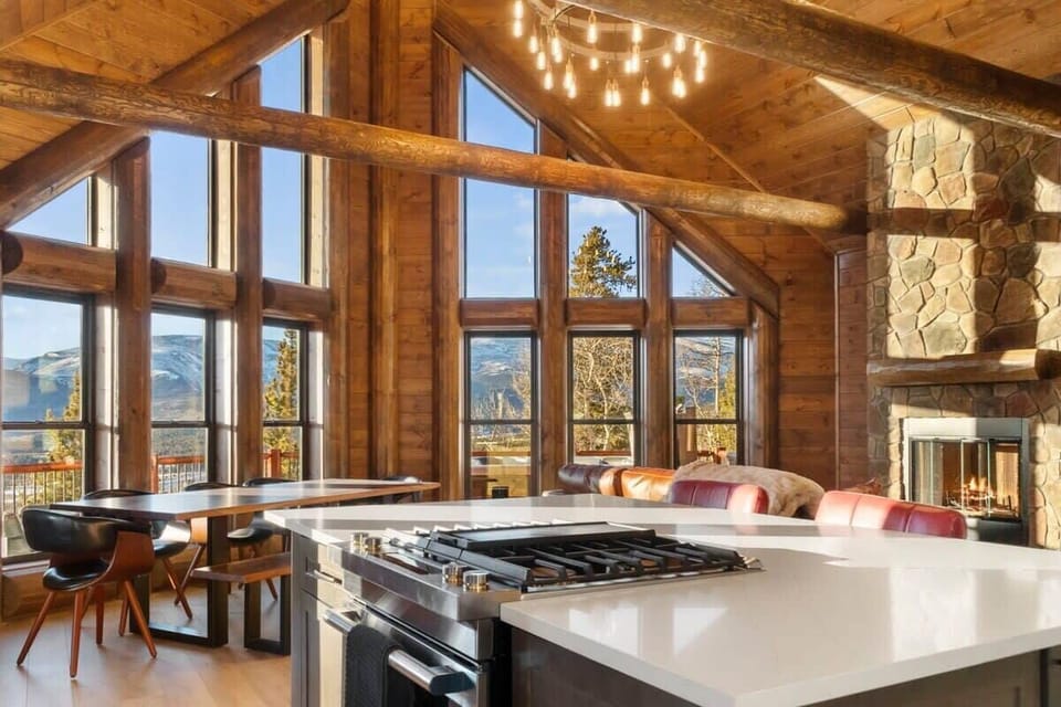 The view from the kitchen towards the soaring windows where you can enjoy mountain views while you meal prep.