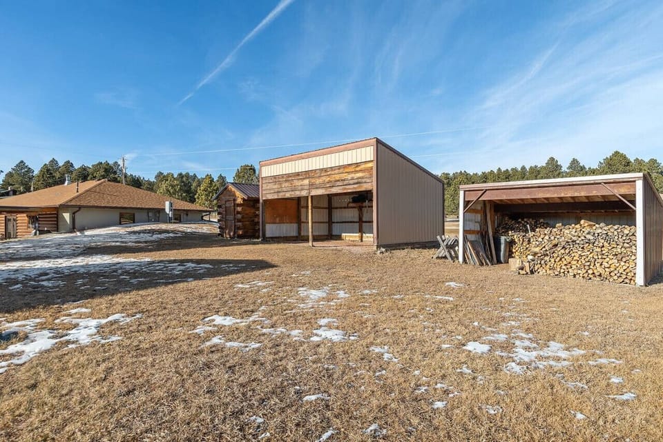 Expansive outdoor area boasting a sauna for relaxation and a convenient garage