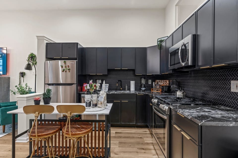 Cook, chat, and sip in style—this modern kitchen is both functional and fabulous for every meal or nightcap.