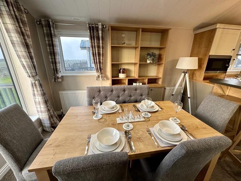 Indoor dining table seats 6. Beautiful views out onto the terrace and fields