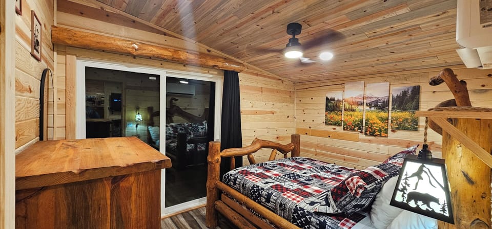 Premium Cabin, 1 Bedroom, Kitchenette | 1 bedroom, down comforters, blackout drapes, iron/ironing board