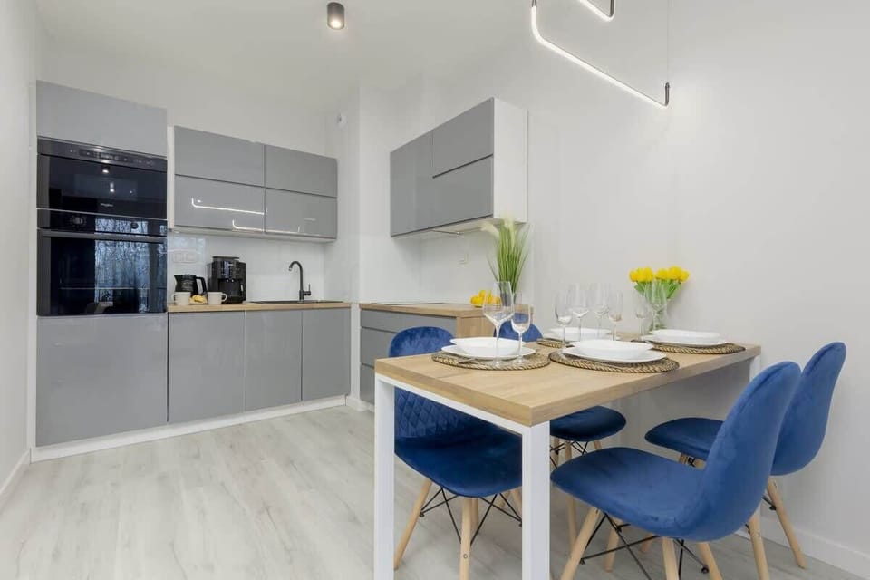 The sleek design of the kitchenette blending seamlessly with the living area.