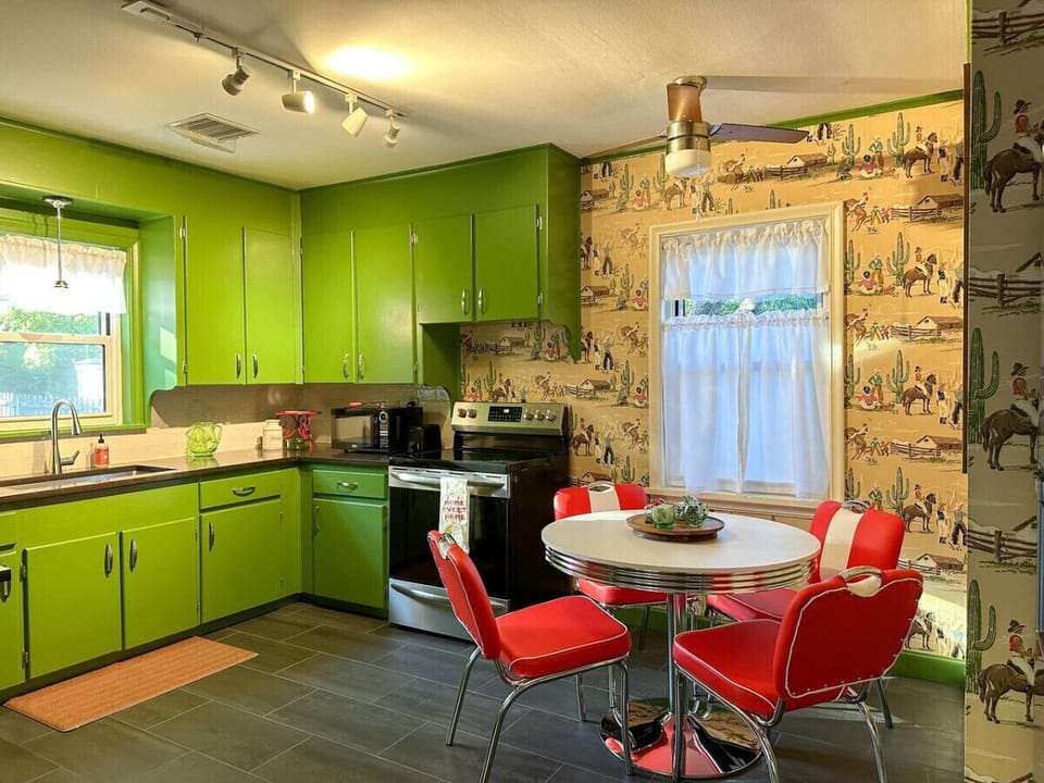 From the billiard room, continue into the unforgettable green kitchen.