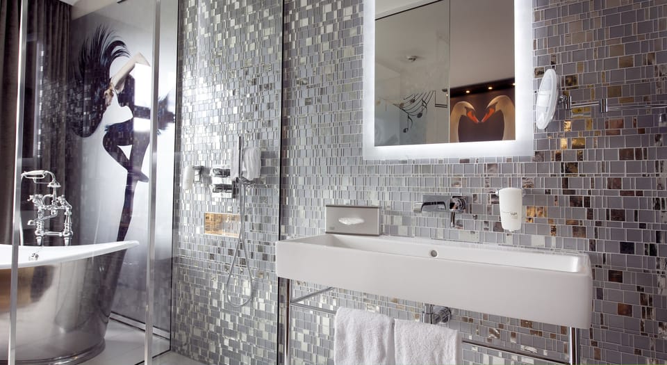 Rainfall showerhead, eco-friendly toiletries, hair dryer, towels