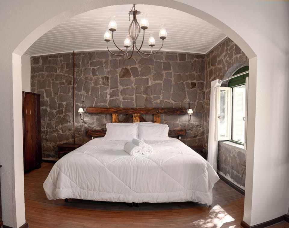 Exclusive Suite, 1 Queen Bed with Sofa bed, Air conditioning | Bathroom | Shower, hair dryer, bathrobes, towels