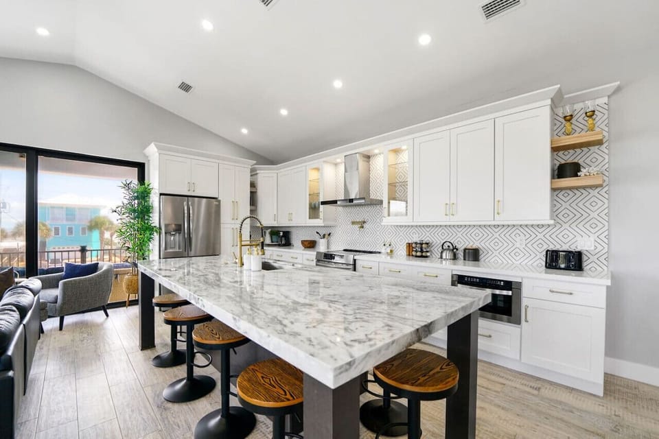 Whip up culinary delights in our stylish kitchen with sleek design and convenient bar seating