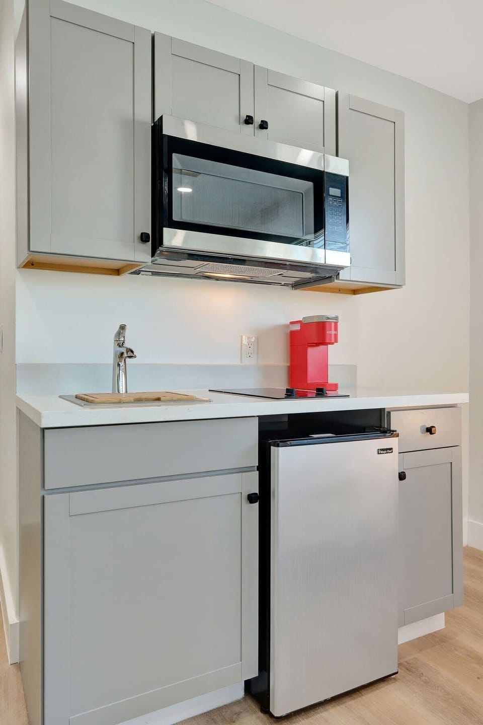 Stocked kitchenette with appliances.
