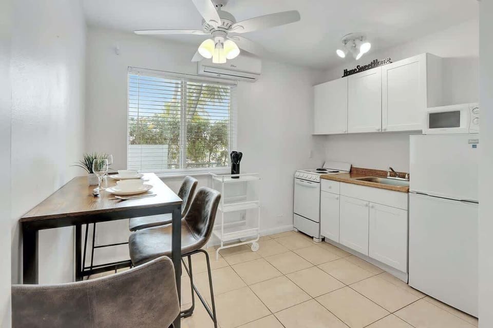 Stocked kitchenette with appliances.