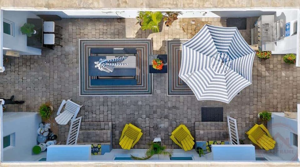 Shared outdoor with courtyard and BBQ area.