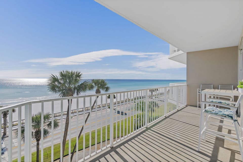 Spacious patio with plenty of seating, perfect for soaking in those Emerald Coast Views - accessible from the living room AND Master bedroom