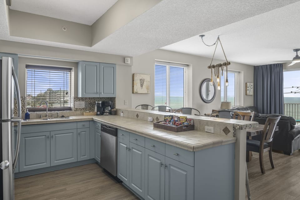 Kitchen has stainless appliances - fully stocked with more than the basics (coffee/tea bar, oils/spices, Tupperware, plenty of pots/pans/cookware)!