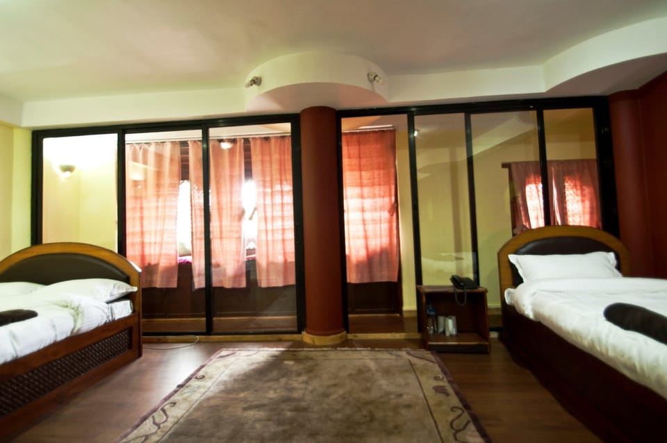 Standard Triple Room, 1 Bedroom, City View | 1 bedroom, in-room safe, desk, soundproofing