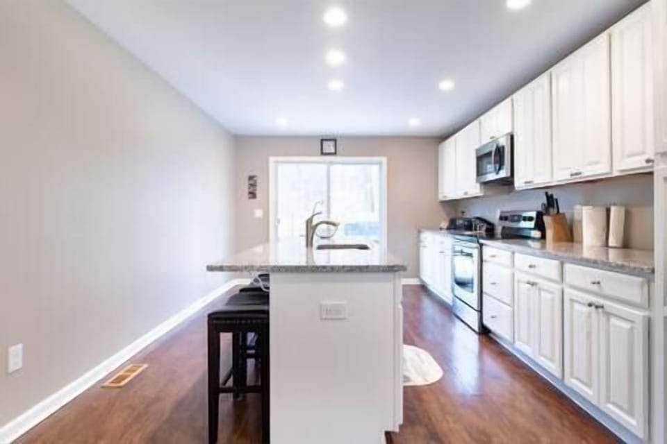 Kitchen island with four stools. 